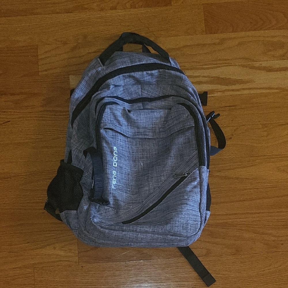 Gray Backpack by Feng Dong